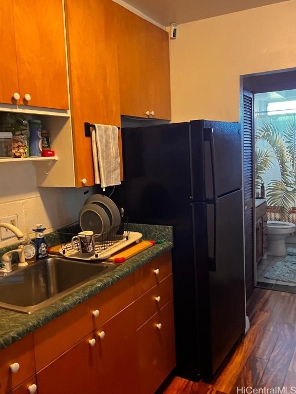 kitchen with dark hardwood / wood-style flooring and sink