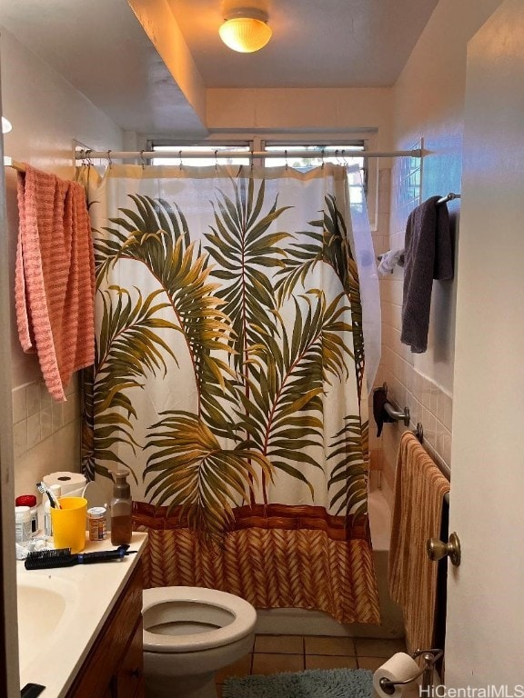 full bathroom with toilet, shower / bath combination with curtain, vanity, and tile patterned floors