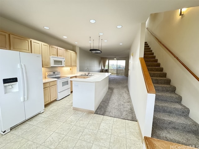 kitchen with kitchen peninsula, light brown cabinets, white appliances, and sink