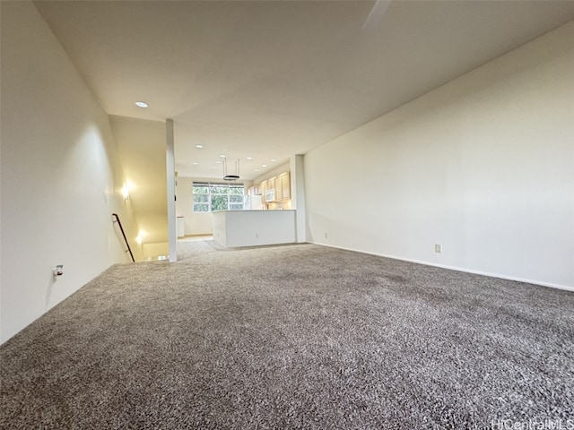 unfurnished living room with carpet