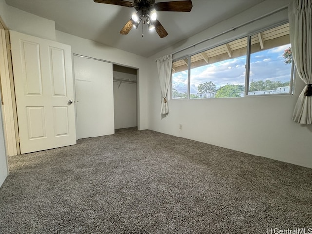 unfurnished bedroom with carpet flooring, ceiling fan, and a closet