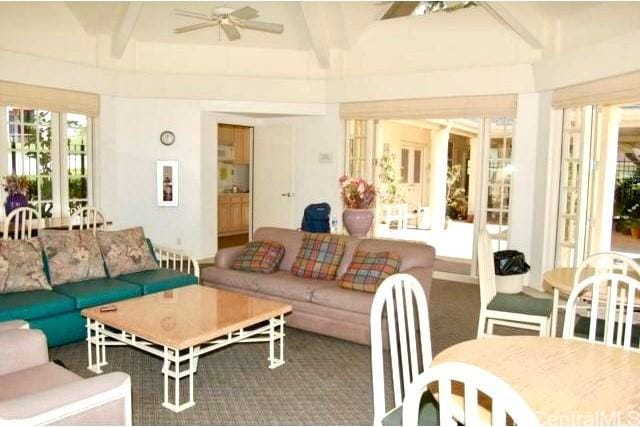 sunroom / solarium with vaulted ceiling with beams and ceiling fan