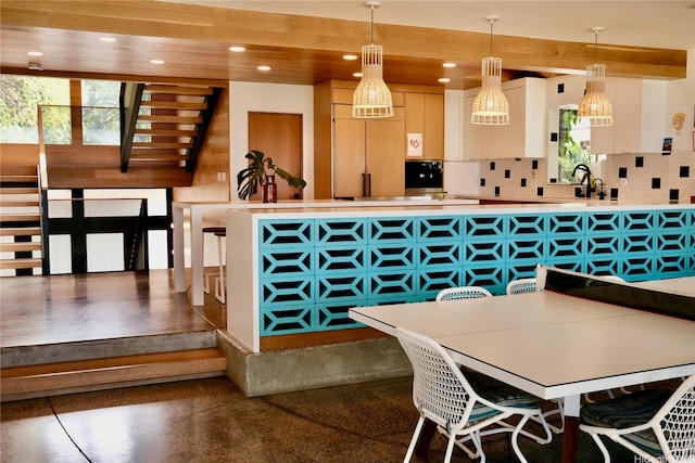 interior space featuring plenty of natural light, recessed lighting, and concrete flooring