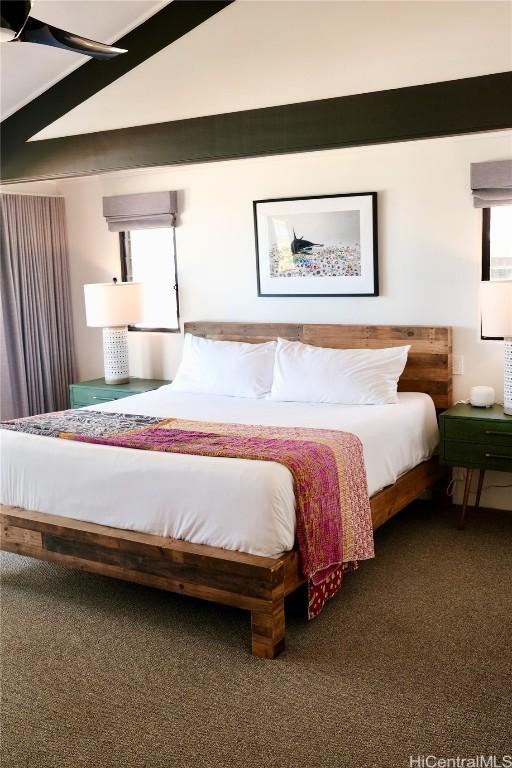 carpeted bedroom with vaulted ceiling