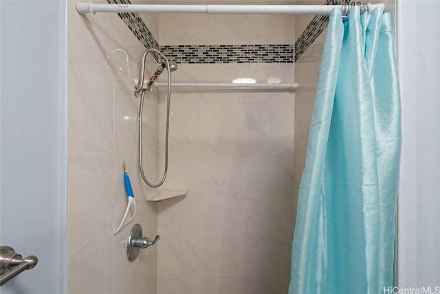 bathroom with a shower with shower curtain