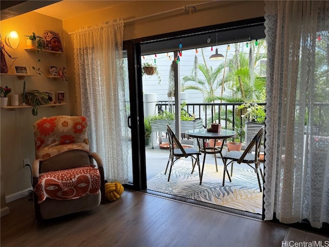 doorway to outside with hardwood / wood-style flooring