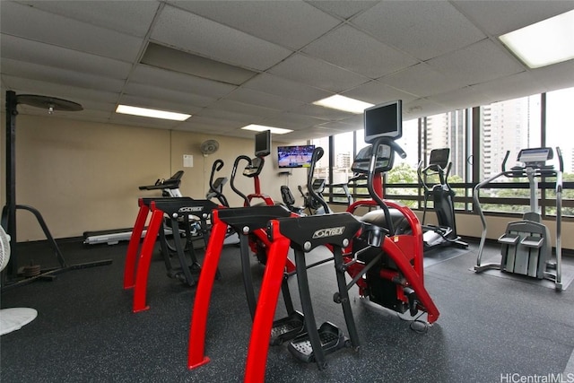 workout area with a paneled ceiling