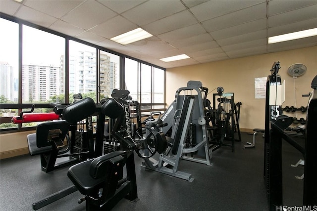 exercise room with a paneled ceiling