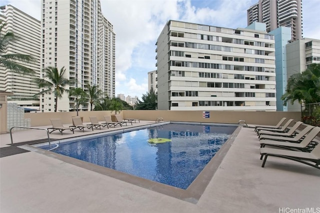 view of swimming pool with a patio