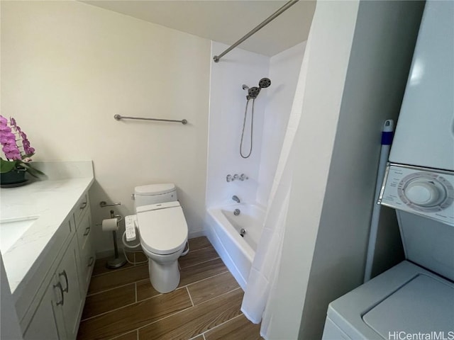 full bathroom with toilet, stacked washer and dryer, vanity, and shower / tub combo with curtain