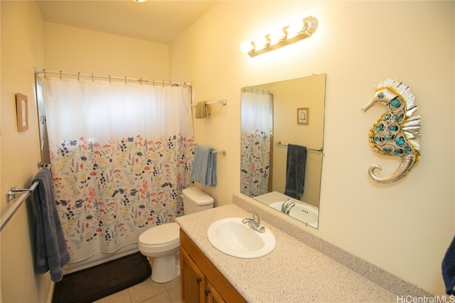 full bathroom featuring tile patterned floors, vanity, shower / tub combo, and toilet