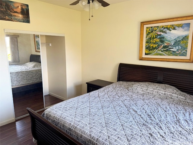 bedroom with ceiling fan and dark hardwood / wood-style flooring