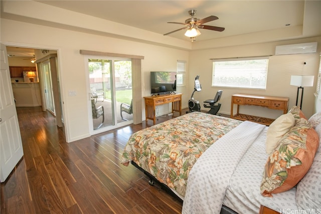 bedroom with access to exterior, dark hardwood / wood-style flooring, a wall unit AC, ceiling fan, and multiple windows