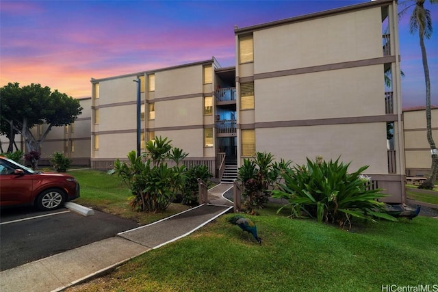 view of outdoor building at dusk