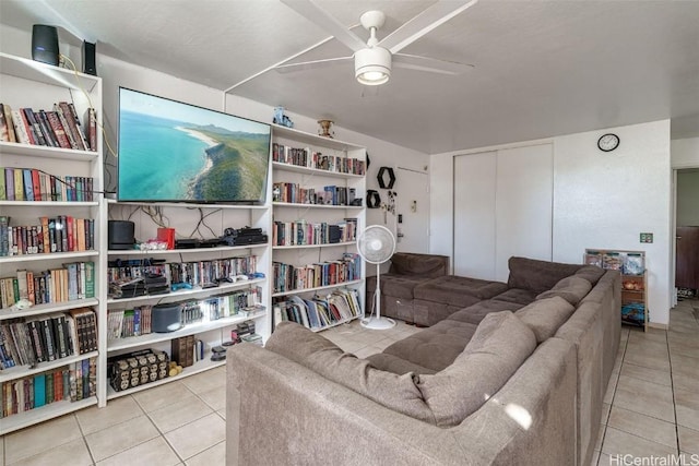 living room featuring ceiling fan and light tile patterned flooring