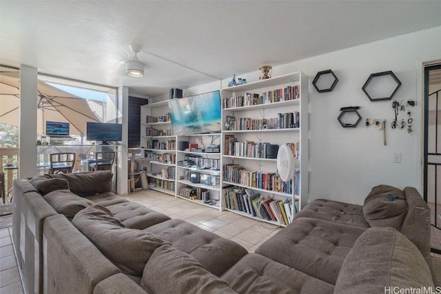 tiled living room featuring ceiling fan