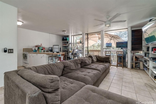 living room with ceiling fan and light tile patterned floors