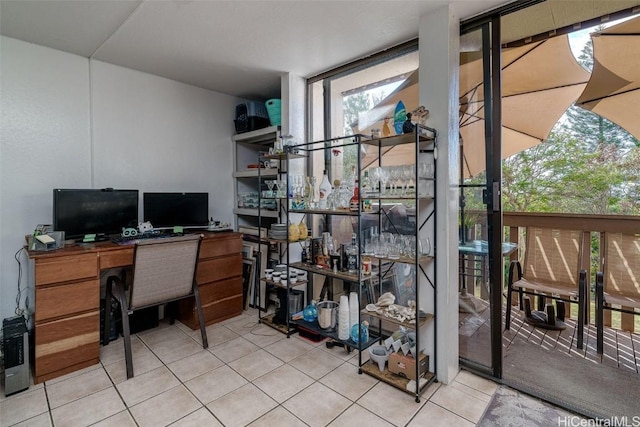 tiled home office with expansive windows