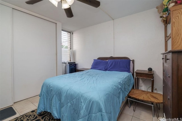 bedroom featuring ceiling fan and light tile patterned floors