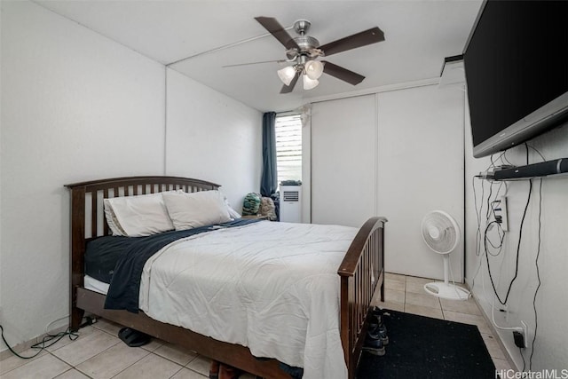 tiled bedroom with ceiling fan