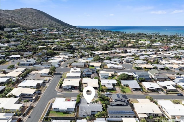 birds eye view of property featuring a water and mountain view