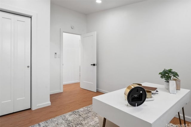 office area with light hardwood / wood-style flooring