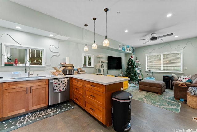 kitchen with ceiling fan, dishwasher, sink, kitchen peninsula, and pendant lighting