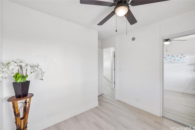 bedroom featuring light hardwood / wood-style floors and ceiling fan