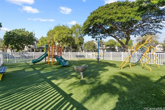 view of play area with a yard and fence