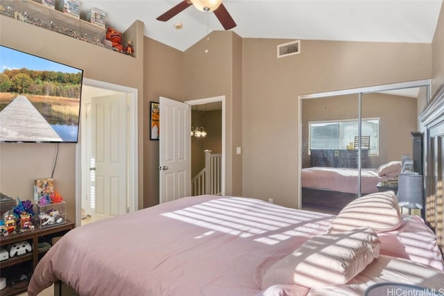 bedroom with visible vents, ceiling fan, and lofted ceiling