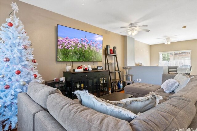 living area with a ceiling fan