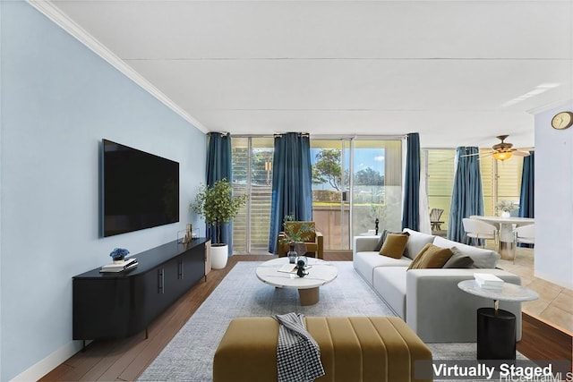 living room featuring hardwood / wood-style floors, ceiling fan, floor to ceiling windows, and crown molding