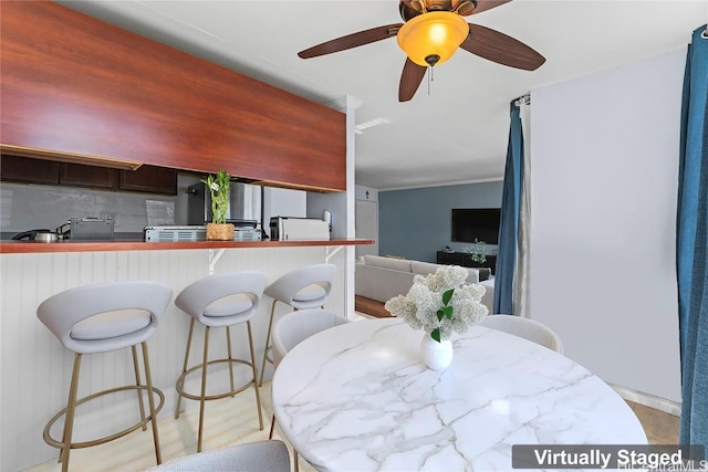 kitchen with tasteful backsplash and kitchen peninsula