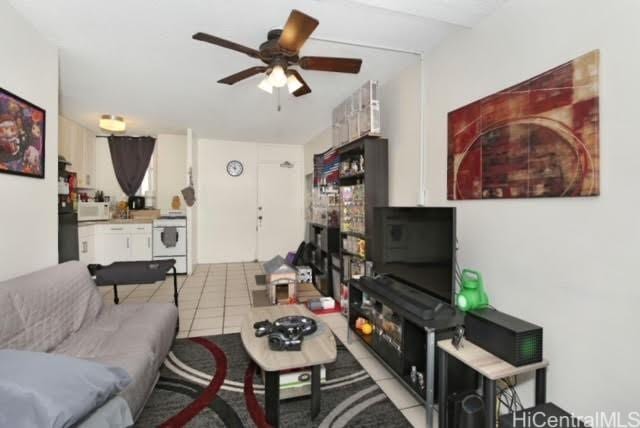 living room featuring ceiling fan, light tile patterned flooring, and pool table