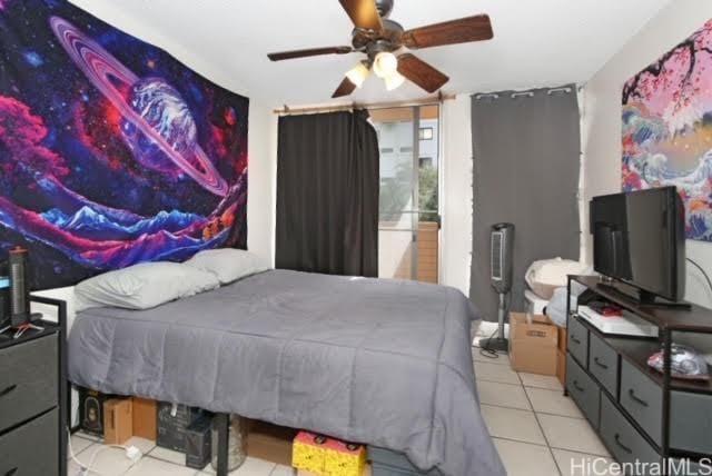 bedroom featuring ceiling fan and light tile patterned floors