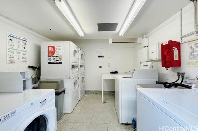 laundry area featuring stacked washer / drying machine and separate washer and dryer