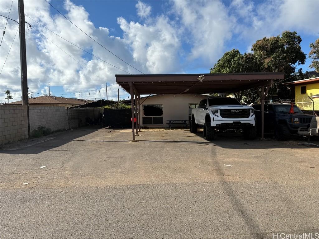 view of car parking with a carport