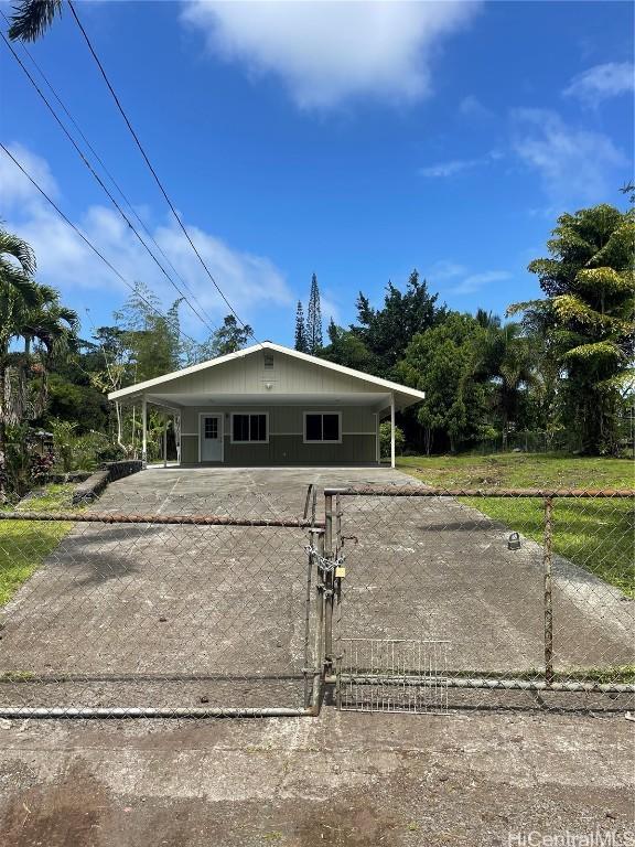 view of front of property with a carport