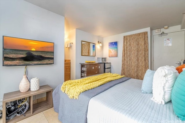 bedroom featuring light tile patterned floors