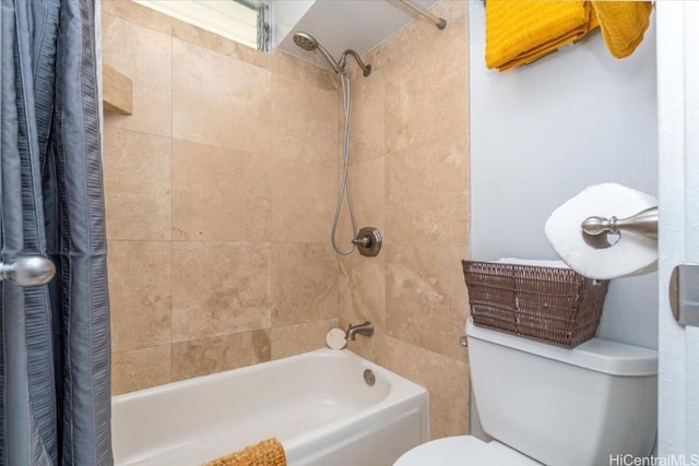 bathroom featuring toilet and shower / bath combo with shower curtain