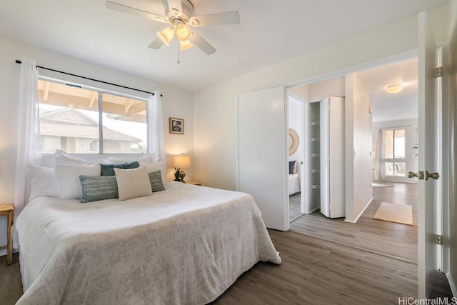 bedroom featuring ceiling fan and hardwood / wood-style flooring