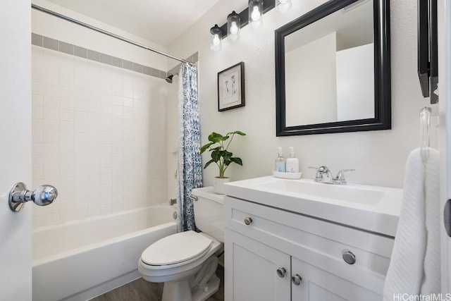 full bathroom with hardwood / wood-style floors, vanity, toilet, and shower / bath combo with shower curtain