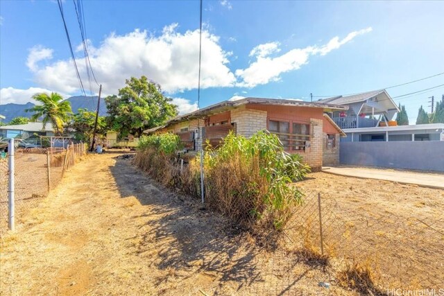 view of side of property with a mountain view