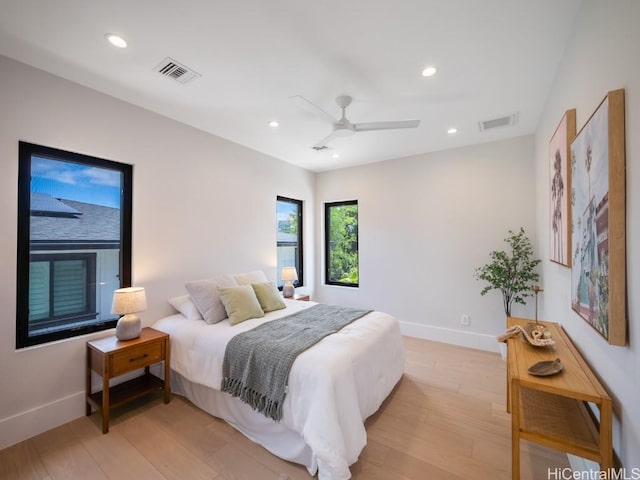 bedroom featuring ceiling fan and light hardwood / wood-style floors