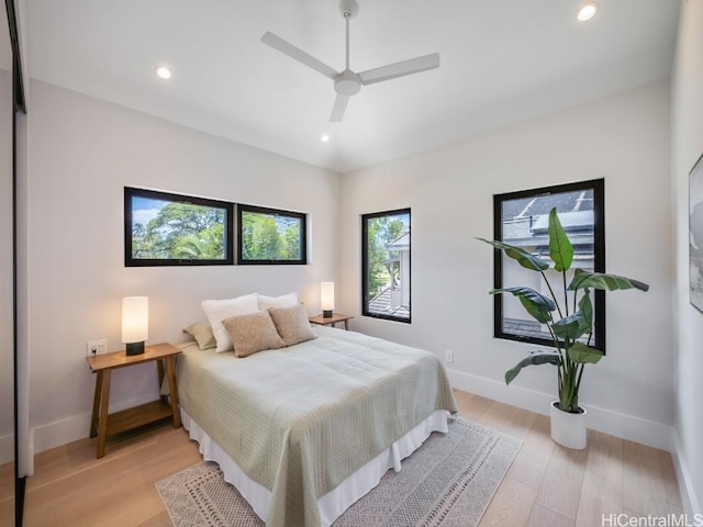 bedroom featuring ceiling fan and light hardwood / wood-style floors