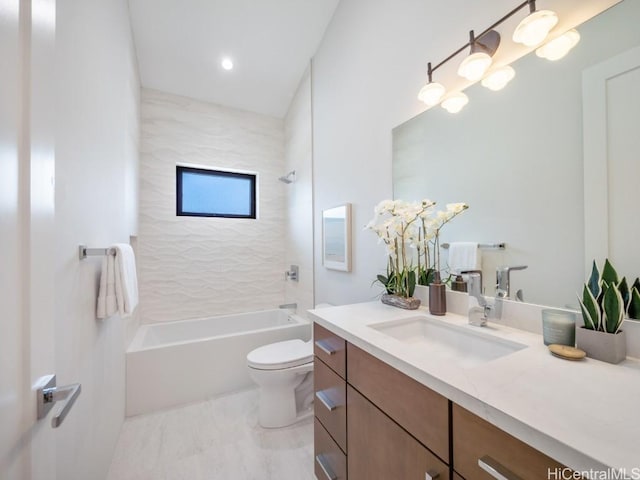 full bathroom with toilet, vanity, and tiled shower / bath combo