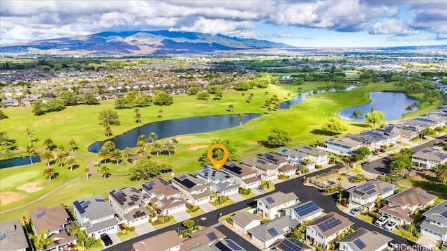 aerial view featuring a water and mountain view