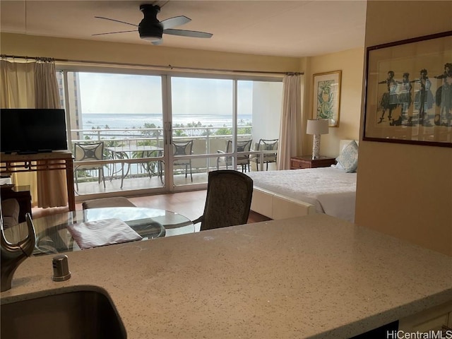 bedroom featuring access to outside and ceiling fan