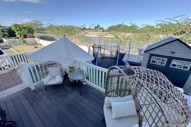 wooden deck with a trampoline