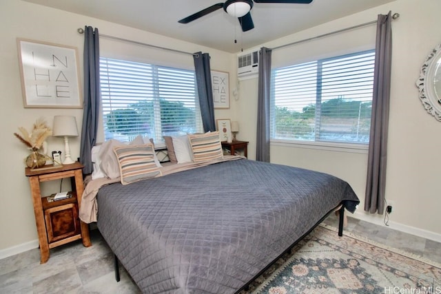 bedroom featuring ceiling fan and a wall mounted air conditioner